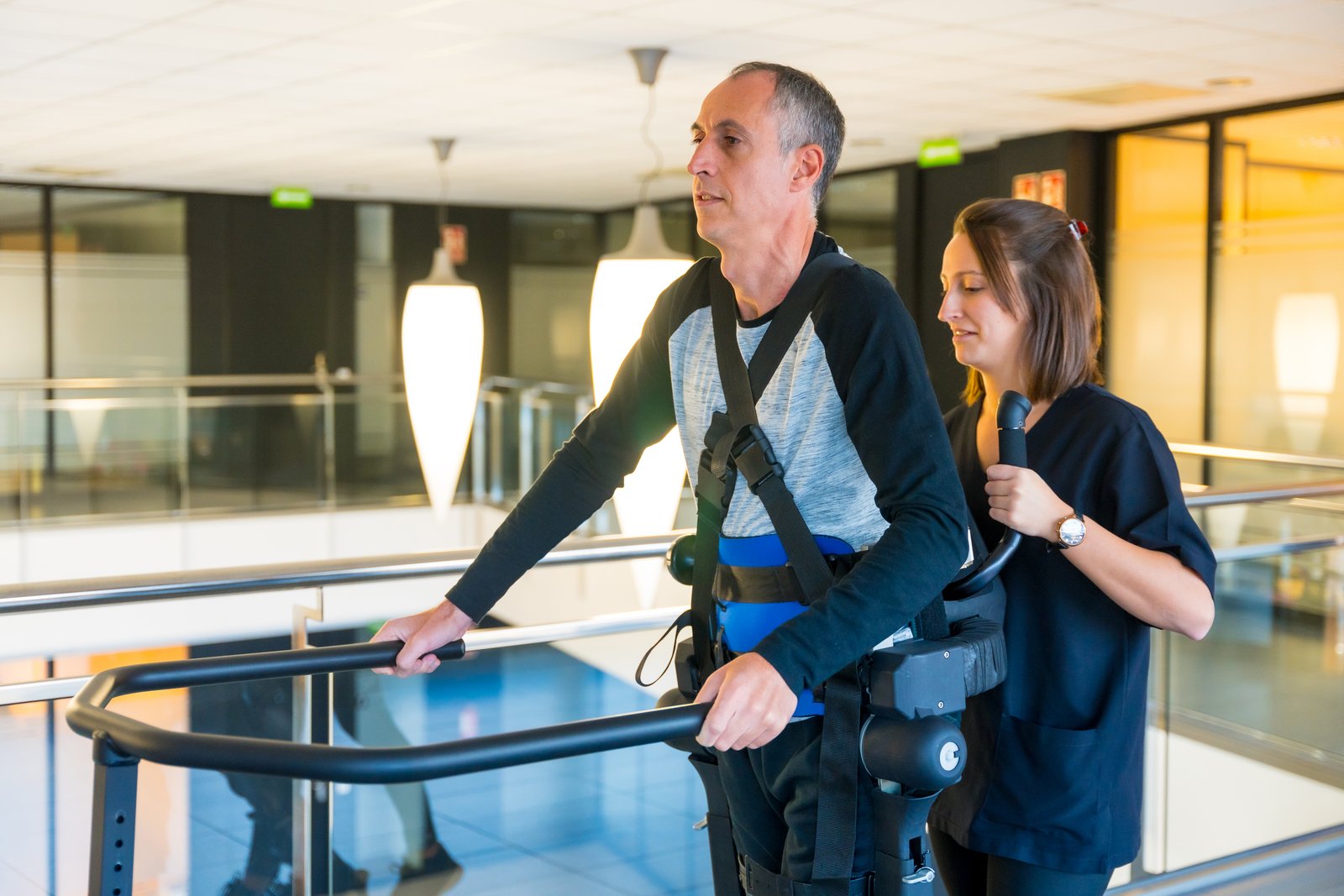 Patient using Neuro Walk Unweighting System for gait training